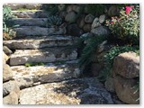 boulder_wall_with_garden_and_stamped_concrete_02